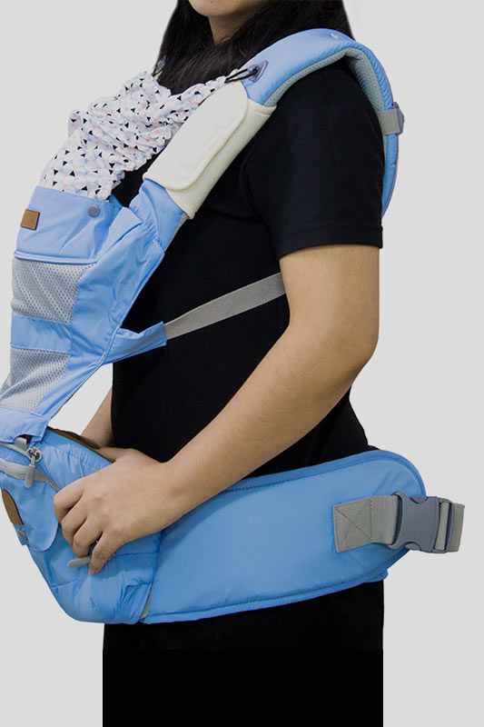 A woman tests a baby carrier