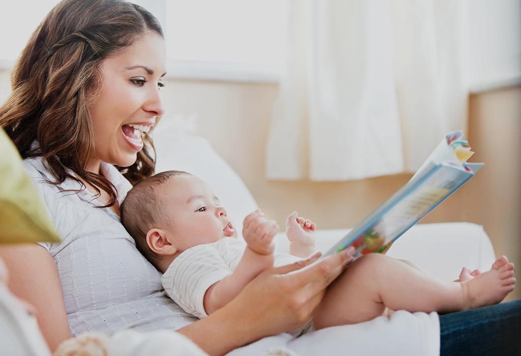 A mother reading to her baby