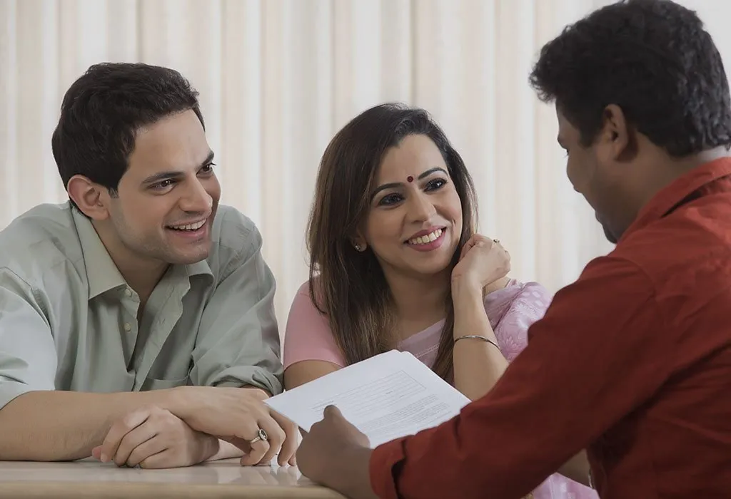 Couple talking to financial advisor