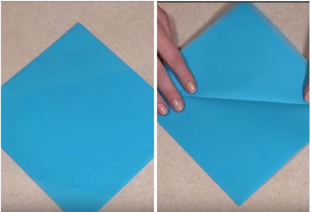 Take a square of paper and fold the left point over the right point to create a crease diagonally.
