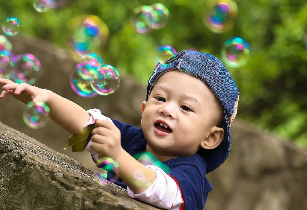Child Playing with bubbles