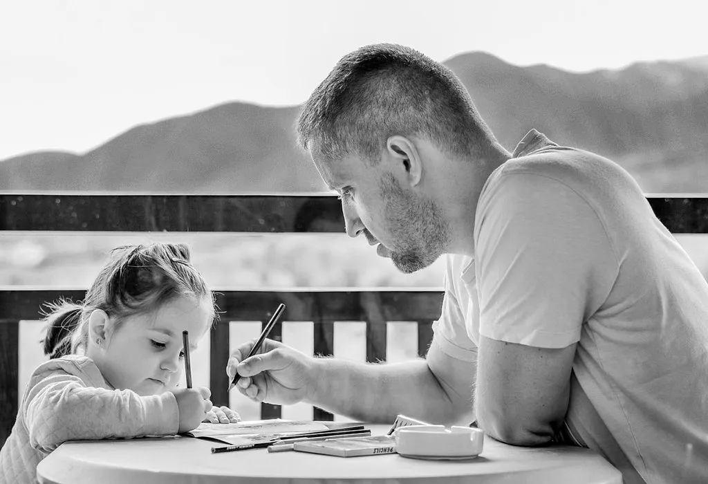 Father and Daughter writing notes