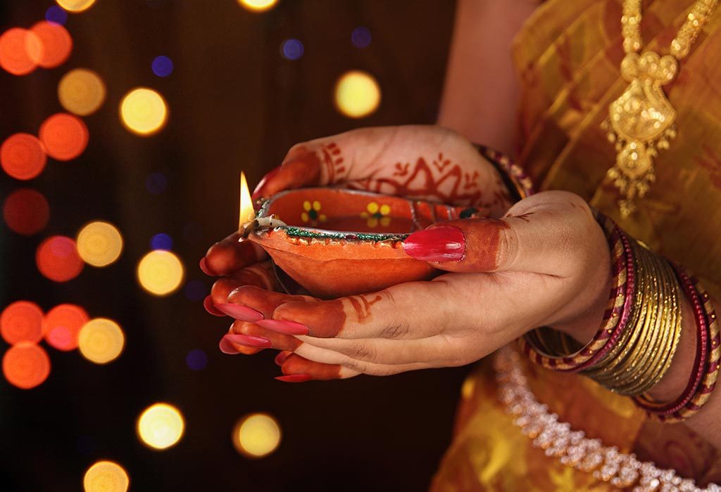 Woman holding Diwali diya