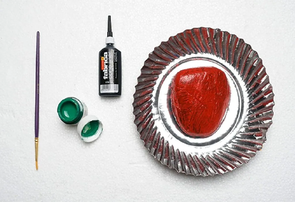 Take a smooth flat rock and keep other supplies ready.