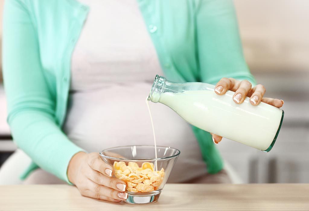 Pregnant woman making cereal