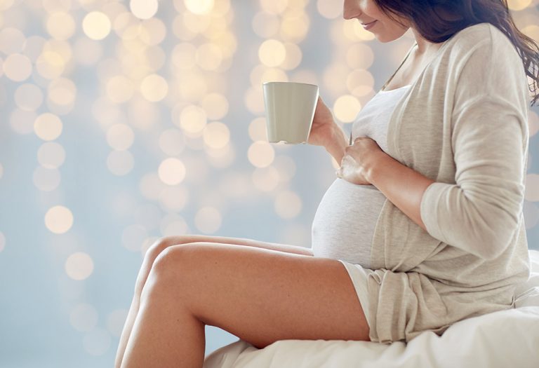 Pregnant woman drinking chamomile tea