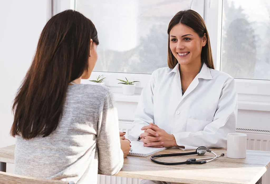 Mother consulting with doctor