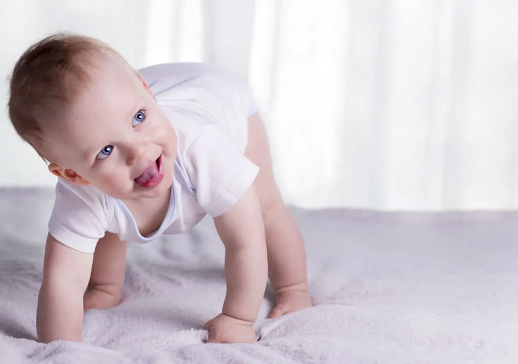 Baby trying to bend her knees and sit down