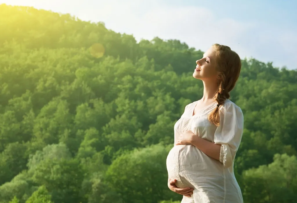 Pregnant woman relaxing in nature