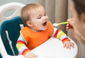 Child eating baby food