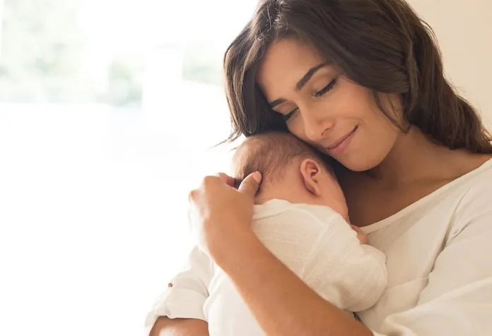 Mother holding newborn