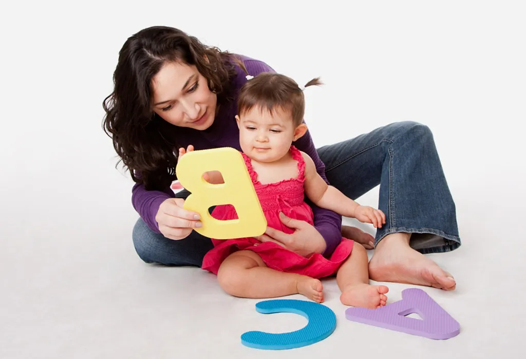 Mother and baby playing with alphabets