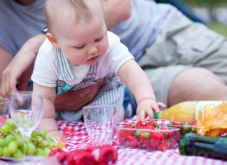 Boy taking fruits on his own
