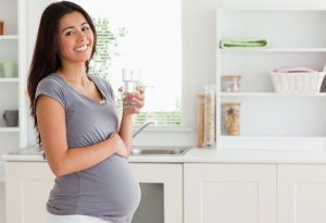 Pregnant woman drinking water