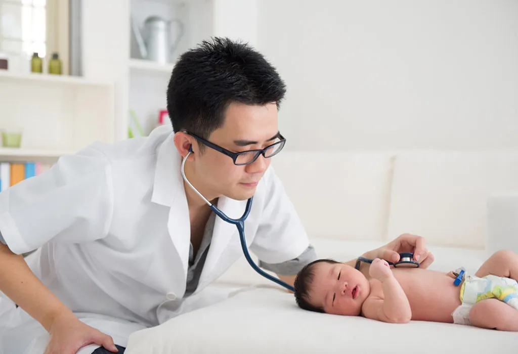 Doctor checking baby
