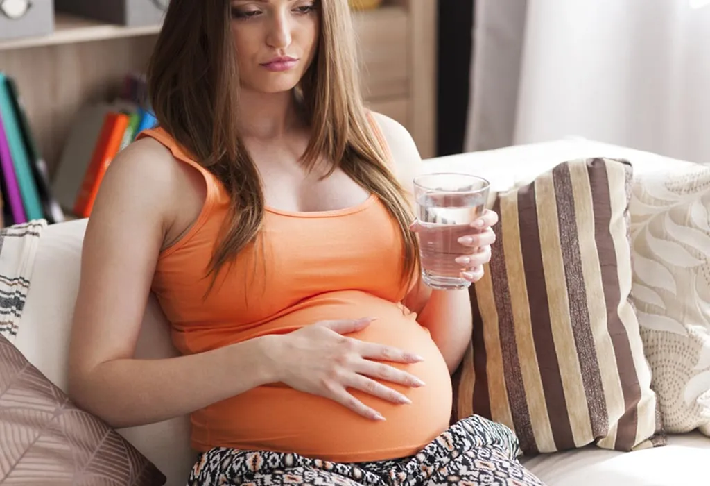A pregnant woman feeling nauseous