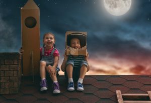 Boy and girl acting as astronauts