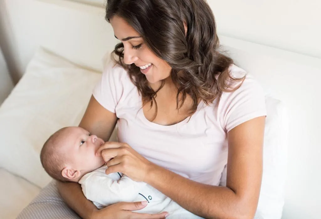 Baby fussing at store breast