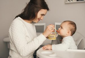 A mother feeding her baby