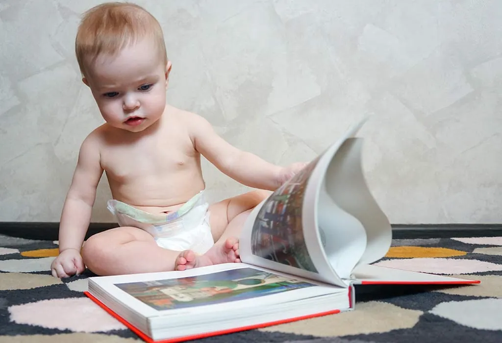 Baby reading book and watching pictures