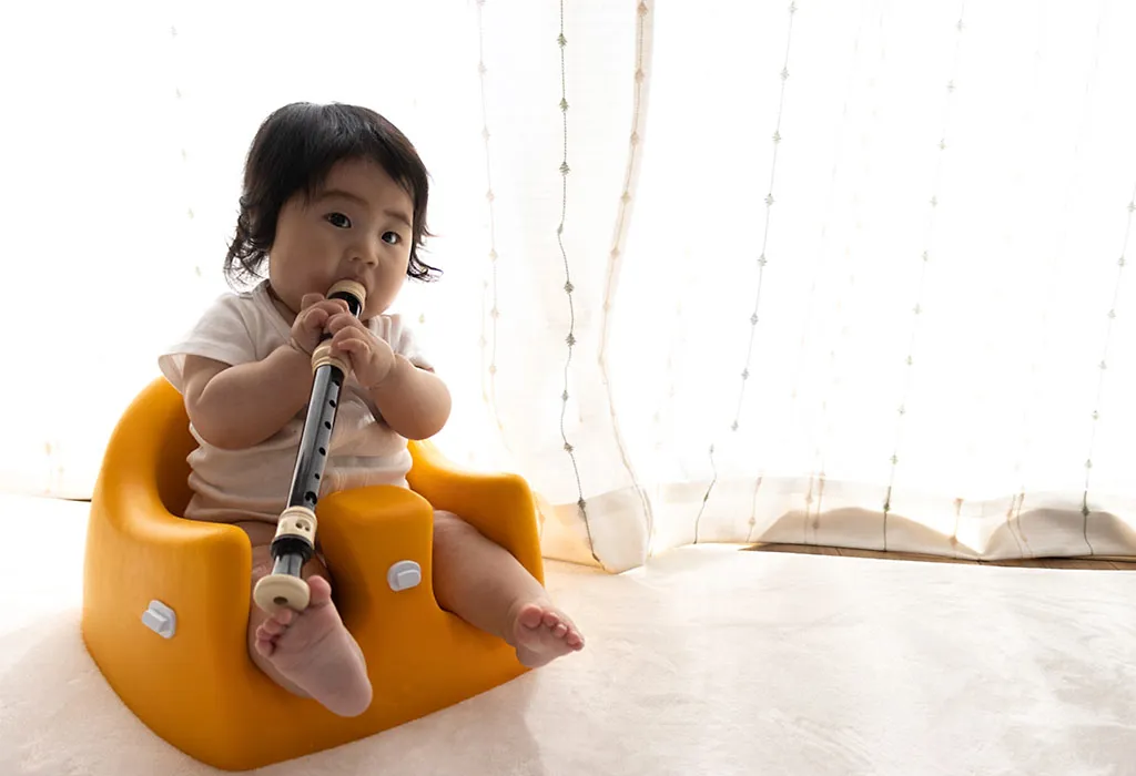 Baby chewing music instruments