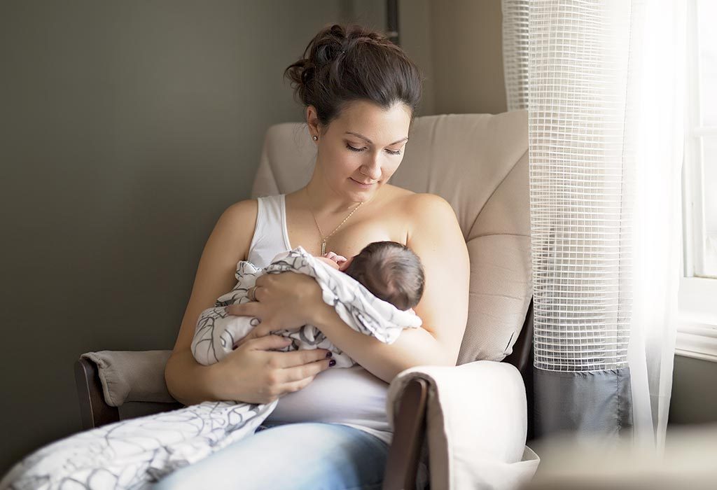 A mother breastfeeding a newborn