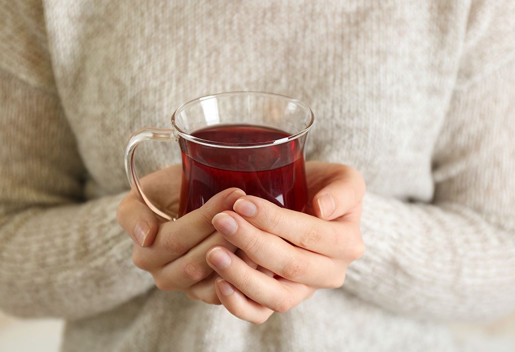 A woman drinking black tea