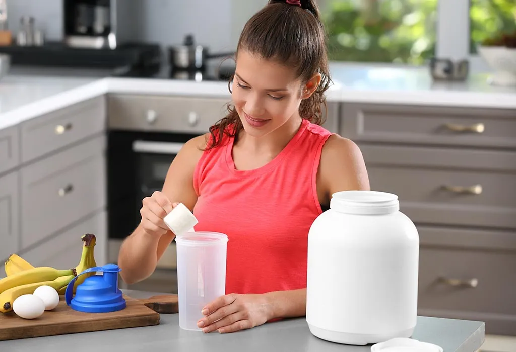 A woman drinking protein shake A woman drinking protein shake
