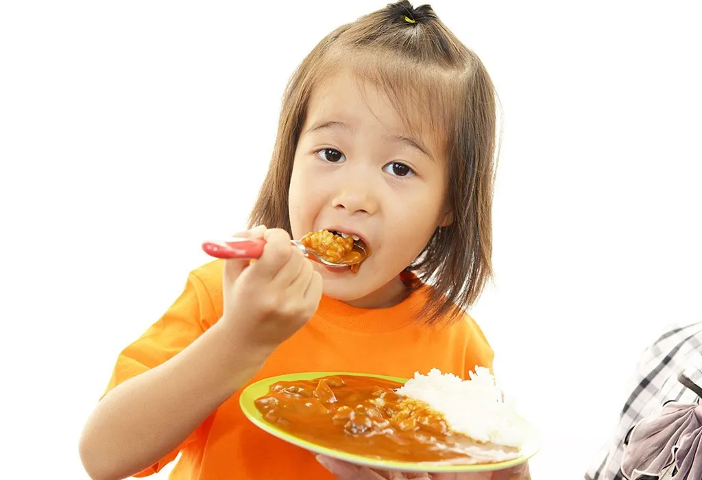 Child eating spicy food