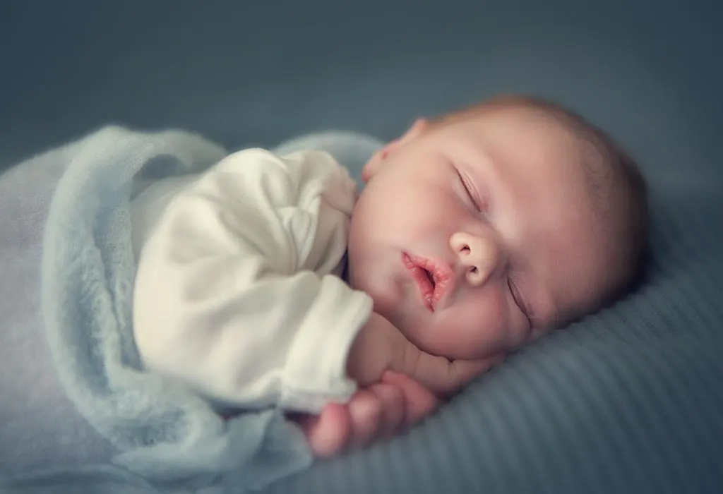 Baby's hands out of the wrap