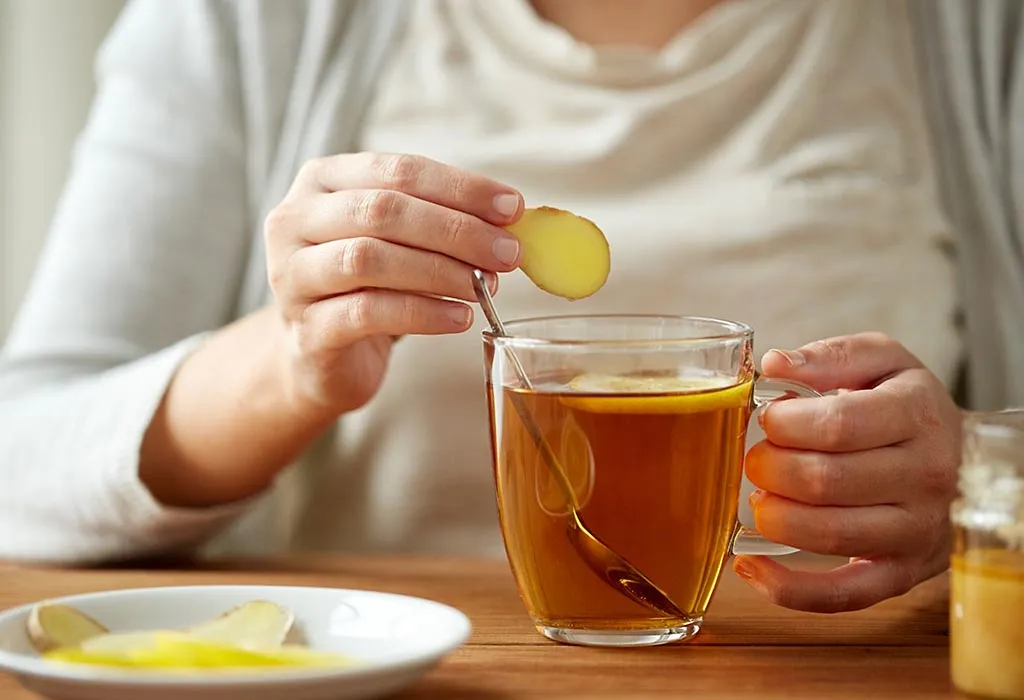 A woman drinking ginger tea