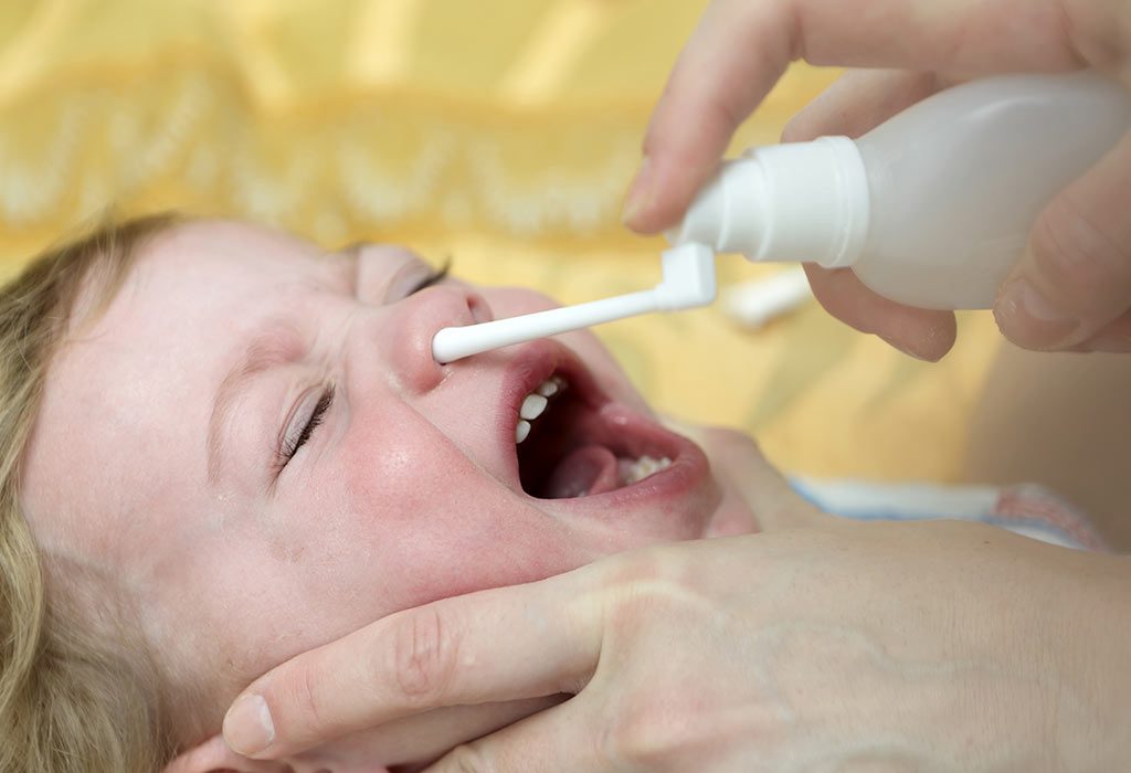 Giving baby saline nose clearance drops