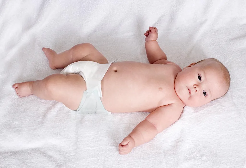 A baby lying on his back