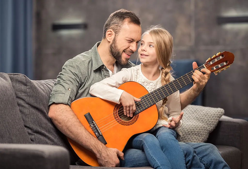 Father and Daughter playing guitar