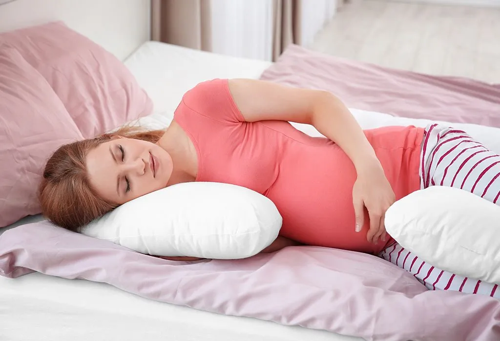 A pregnant woman lying on the left side