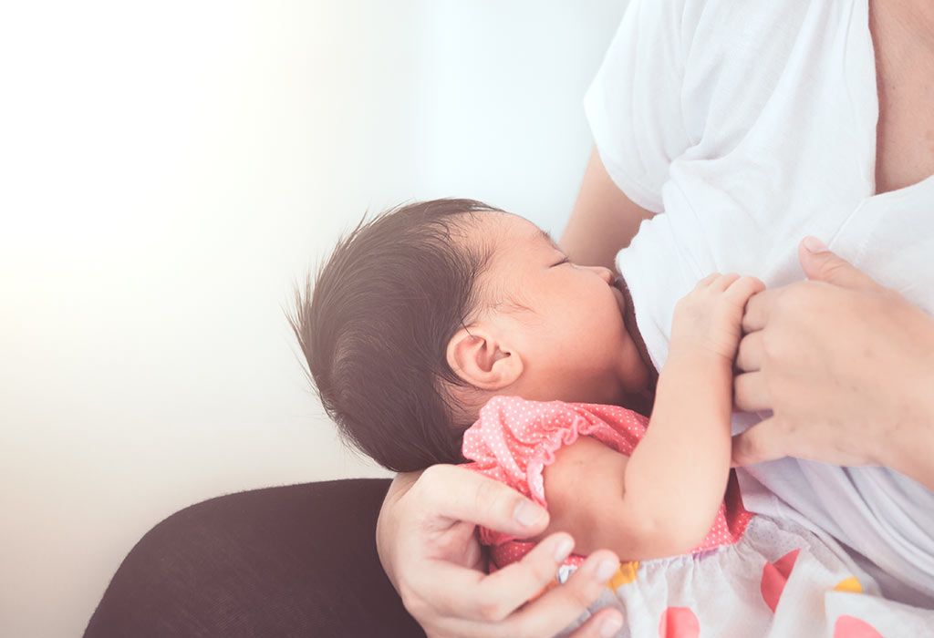 A mother breastfeeding her baby