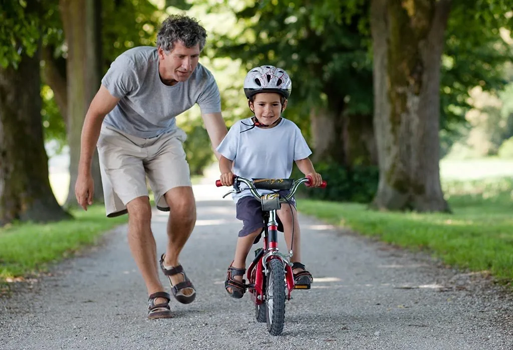 Boy learning to store ride bike