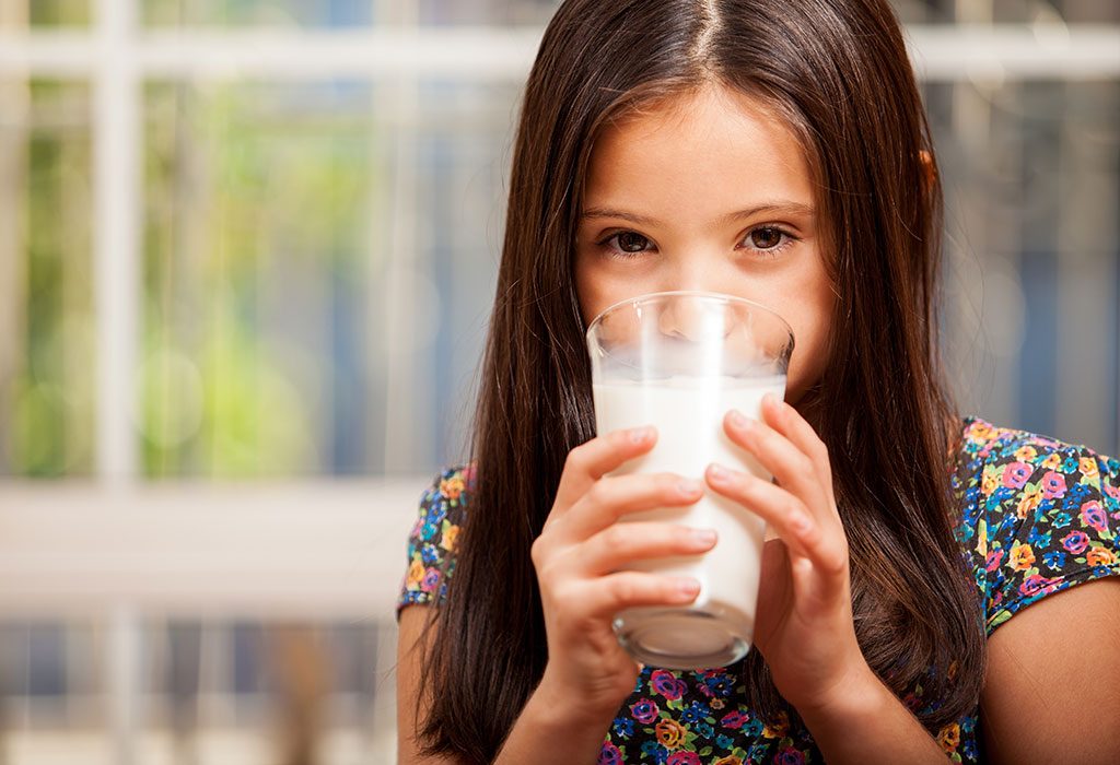 child drinking milk