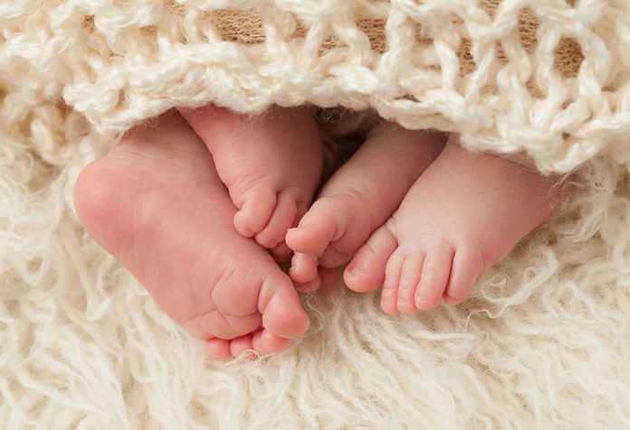 Feet of newborn twins