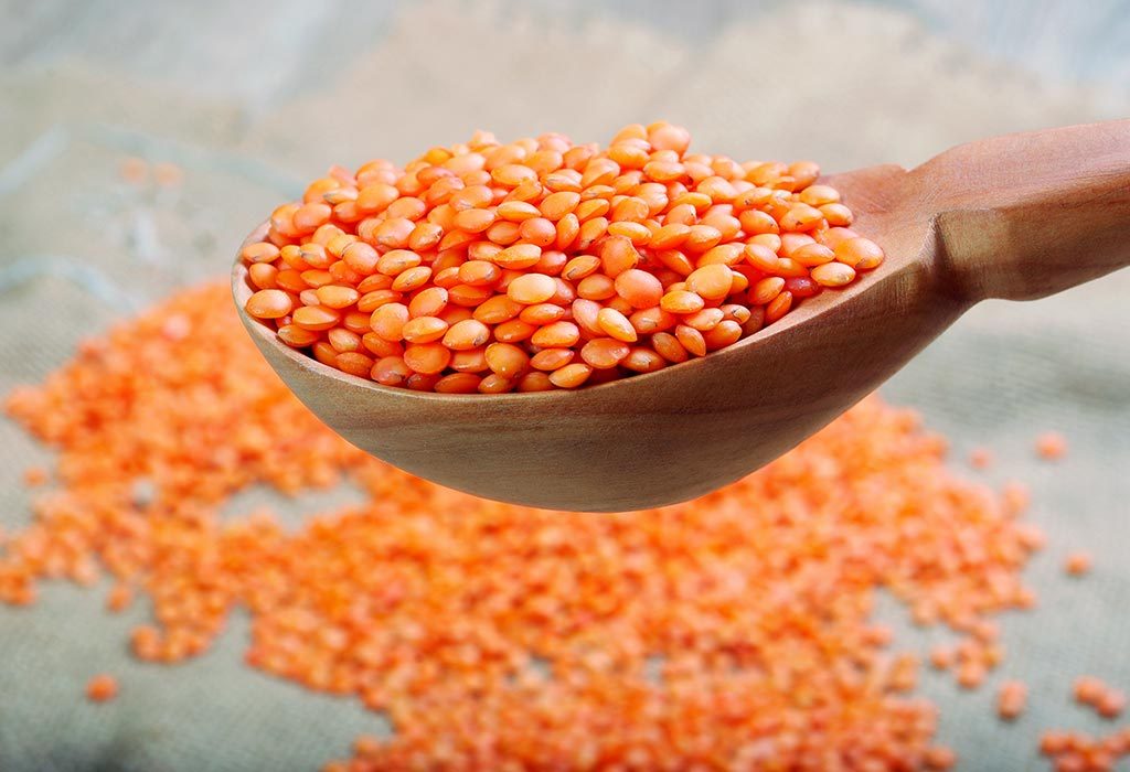 Red lentils in a spoon