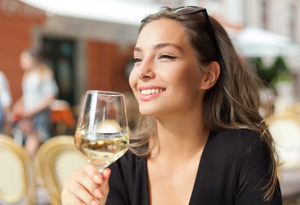 A woman drinking wine A woman drinking wine