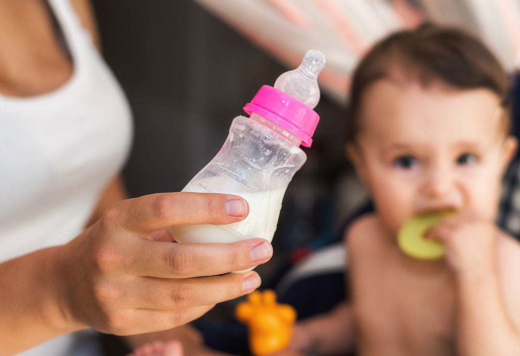 Mother preparing formula milk