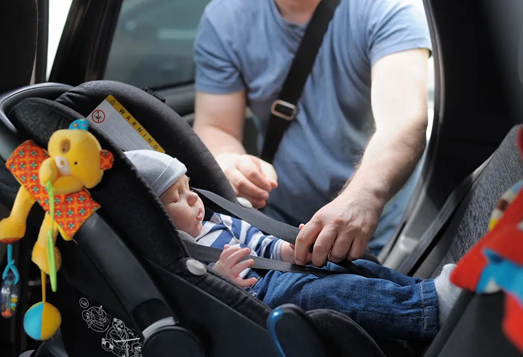 Infant placed in the middle of the back seat Infant placed in the middle of the back seat