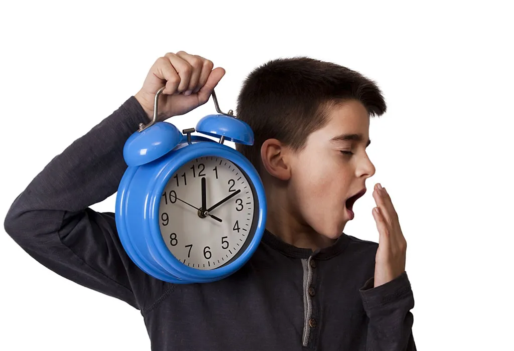 boy holding watch