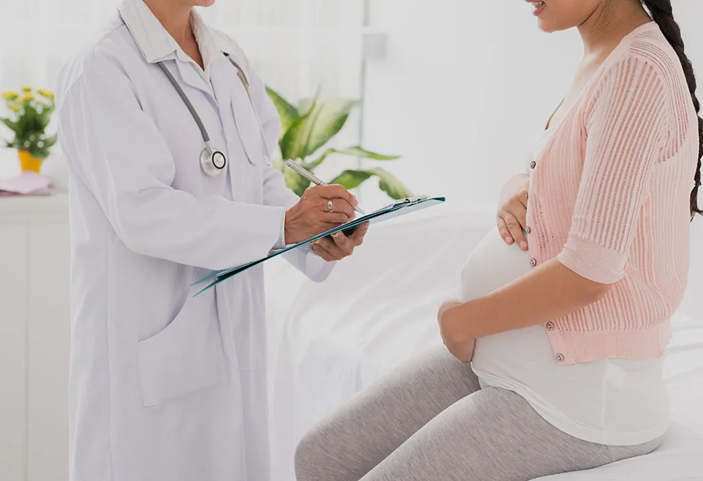 Pregnant women consulting doctor Pregnant women consulting doctor