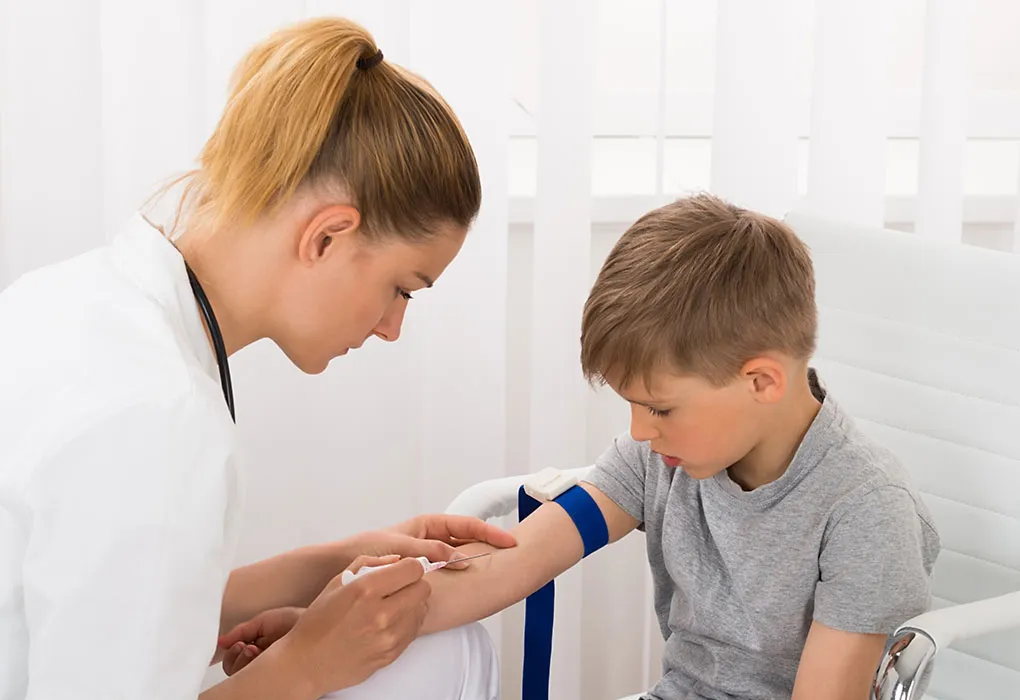 A doctor conducting blood test of a child