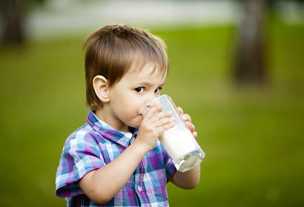 A child drinking almond mik