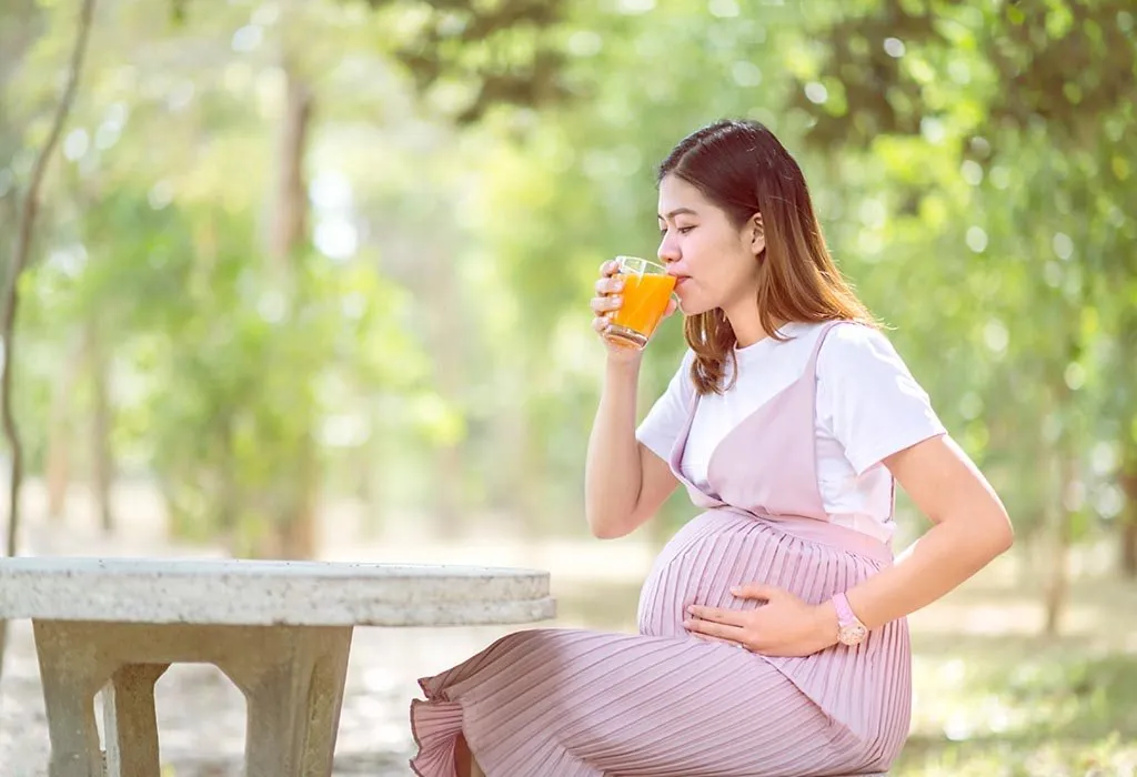 Pregnant lady drinkin juice