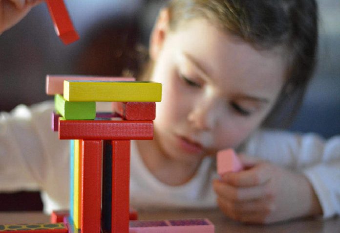 encouraging toddler to play with building blocks