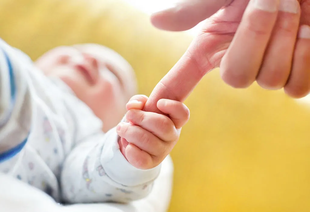 Tiny Fingers Gripping Dad’s Thumb